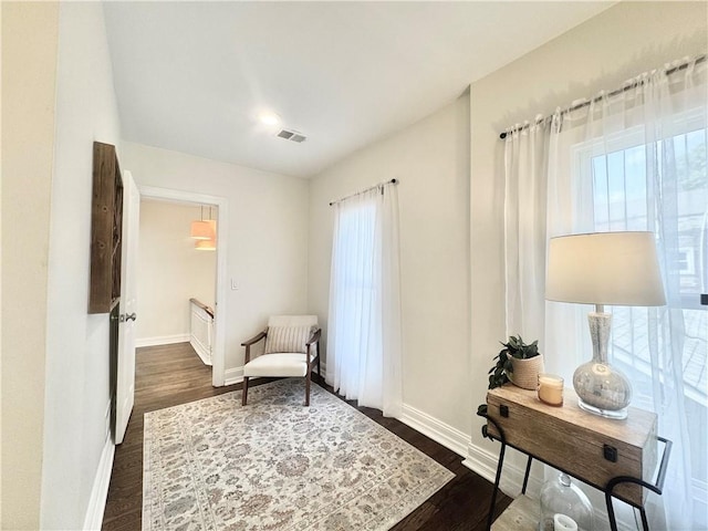 1643 Jefferson St, Kansas City, MO 64108 - living area with baseboards and dark wood-style floors