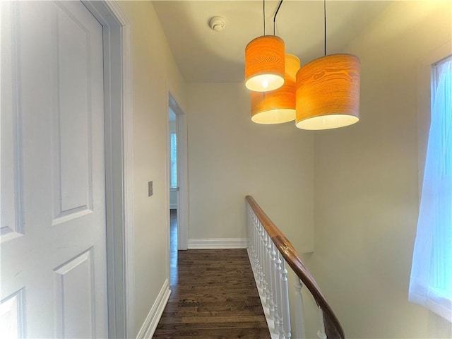 1643 Jefferson St, Kansas City, MO 64108 - hallway with an upstairs landing and dark wood-type flooring