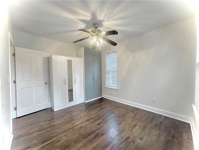 1643 Jefferson St, Kansas City, MO 64108 - unfurnished bedroom with dark wood-type flooring, ceiling fan, and a closet