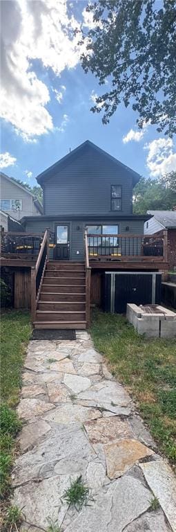 1643 Jefferson St, Kansas City, MO 64108 - rear view of house with stairway and a deck