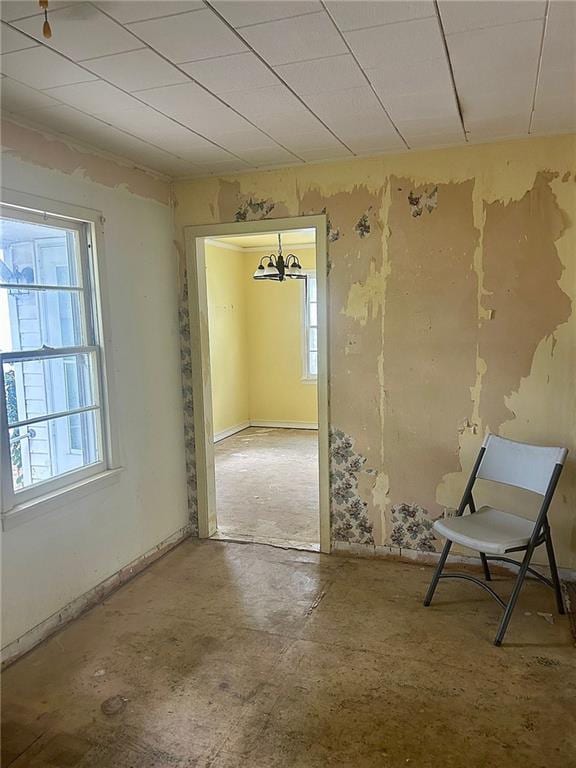 3107 Wood Ave, Parsons, KS 67357 - unfurnished room with a chandelier