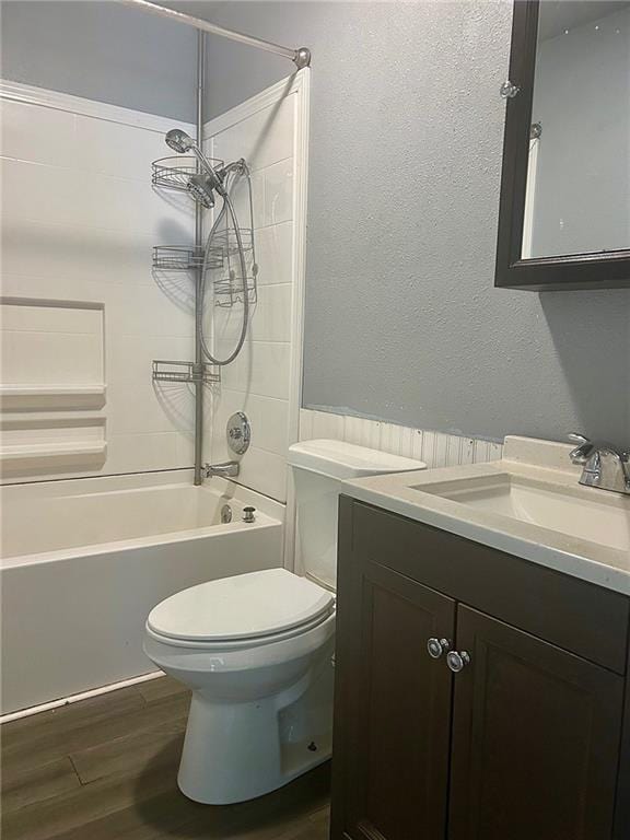 3107 Wood Ave, Parsons, KS 67357 - full bathroom featuring vanity,  shower combination, and wood finished floors