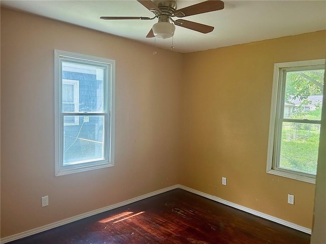 3107 Wood Ave, Parsons, KS 67357 - unfurnished room featuring dark wood-style floors and ceiling fan