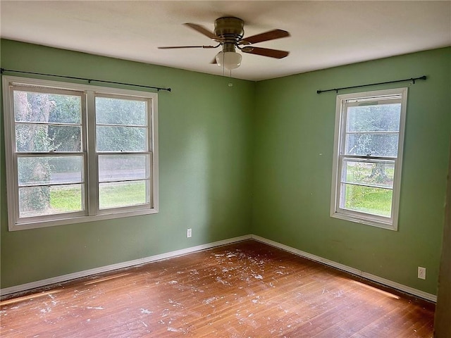 3107 Wood Ave, Parsons, KS 67357 - empty room featuring hardwood / wood-style flooring and ceiling fan