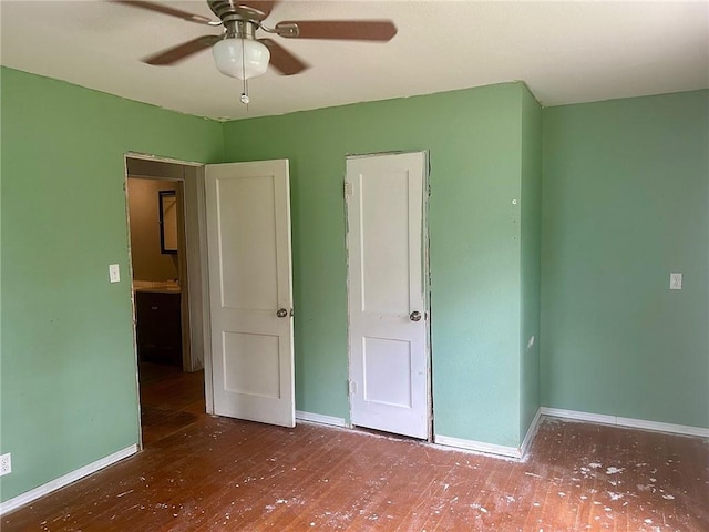 3107 Wood Ave, Parsons, KS 67357 - unfurnished bedroom featuring wood finished floors and ceiling fan