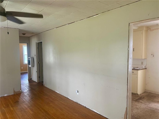 3107 Wood Ave, Parsons, KS 67357 - empty room featuring a ceiling fan and light wood-style flooring