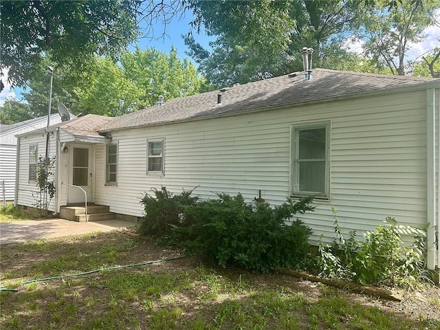 3107 Wood Ave, Parsons, KS 67357 - view of side of property with roof with shingles