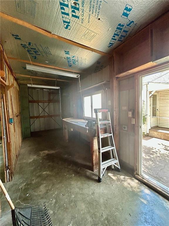 3107 Wood Ave, Parsons, KS 67357 - miscellaneous room with unfinished concrete flooring
