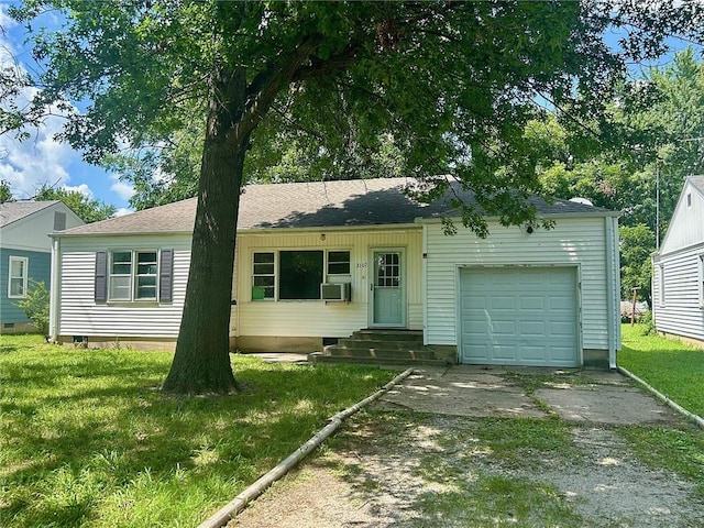 3107 Wood Ave, Parsons, KS 67357 - single story home with a garage, driveway, entry steps, a front lawn, and roof with shingles