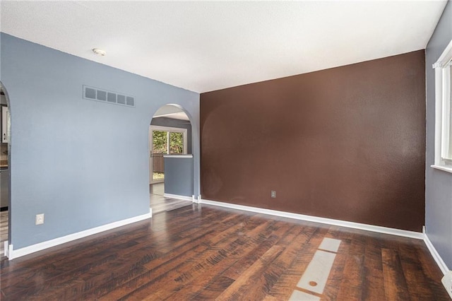 2005 Manor Pl, Blue Springs, MO 64015 - unfurnished room with arched walkways, wood finished floors, and a smoke detector
