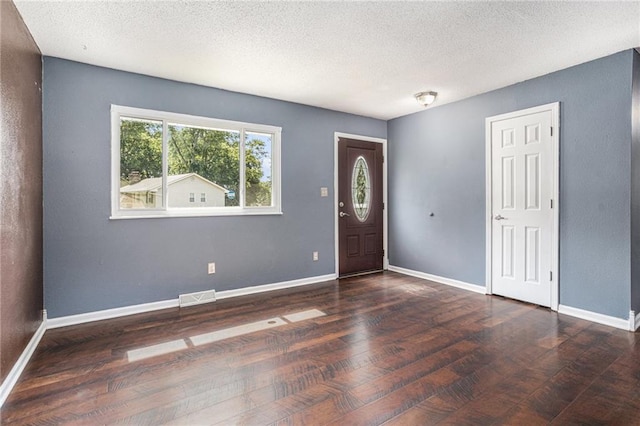 2005 Manor Pl, Blue Springs, MO 64015 - foyer entrance with wood finished floors and a textured ceiling