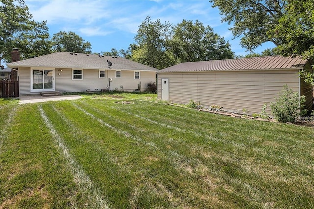 2005 Manor Pl, Blue Springs, MO 64015 - rear view of property featuring a patio and a metal roof