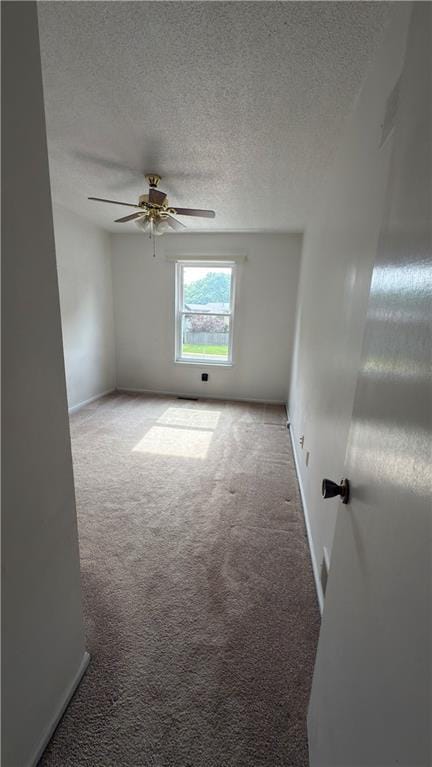 11965 W 66th St, Shawnee, KS 66216 - spare room with carpet, a ceiling fan, and a textured ceiling