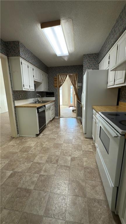 11965 W 66th St, Shawnee, KS 66216 - kitchen with white electric stove, dishwasher, white cabinets, and a textured ceiling