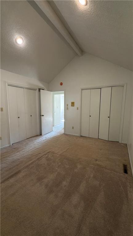 11965 W 66th St, Shawnee, KS 66216 - unfurnished bedroom with a textured ceiling, multiple closets, and carpet floors