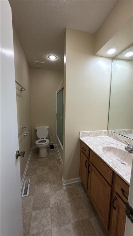 11965 W 66th St, Shawnee, KS 66216 - bathroom featuring vanity and a textured ceiling