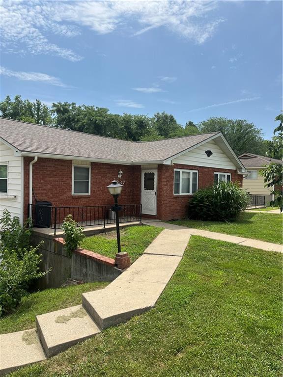 1835-1837 N 77th St, Kansas City, KS 66112 - single story home featuring brick siding, a front yard, and roof with shingles