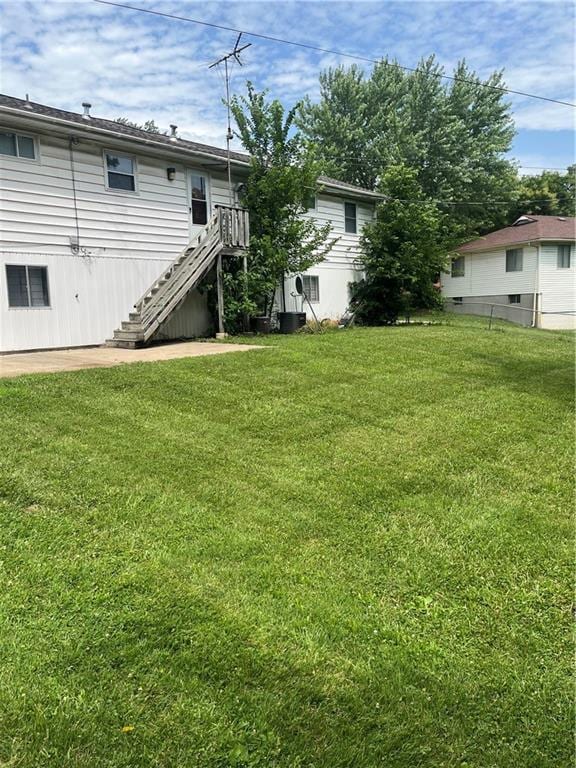 1835-1837 N 77th St, Kansas City, KS 66112 - view of grassy yard featuring stairs
