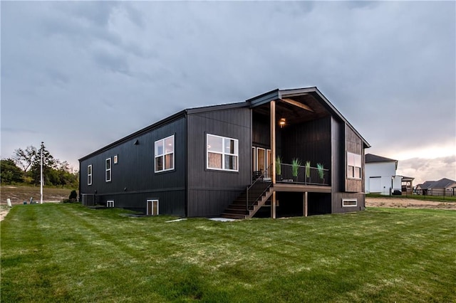 18221 W 168th Ter, Olathe, KS 66062 - back of property featuring a lawn and stairway
