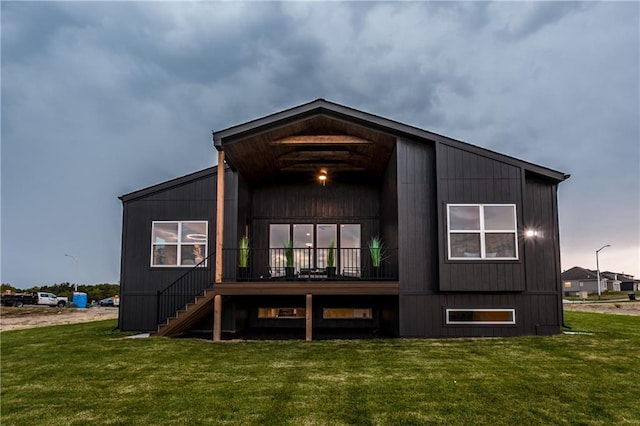 18221 W 168th Ter, Olathe, KS 66062 - rear view of house featuring a yard, stairs, and a wooden deck