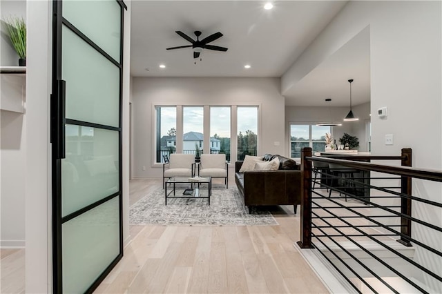 18221 W 168th Ter, Olathe, KS 66062 - living room featuring a ceiling fan, light wood-style flooring, and recessed lighting