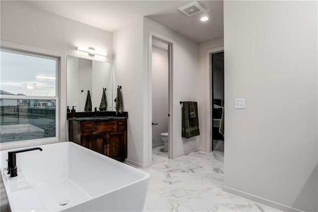 18221 W 168th Ter, Olathe, KS 66062 - bathroom with marble finish flooring, a soaking tub, vanity, and recessed lighting