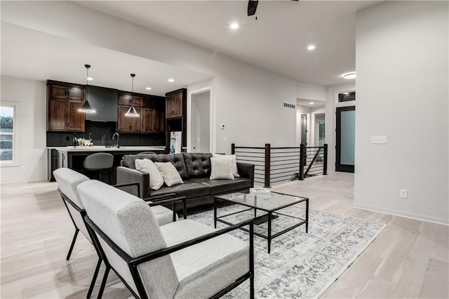 18221 W 168th Ter, Olathe, KS 66062 - living area with recessed lighting, light wood-type flooring, and a ceiling fan