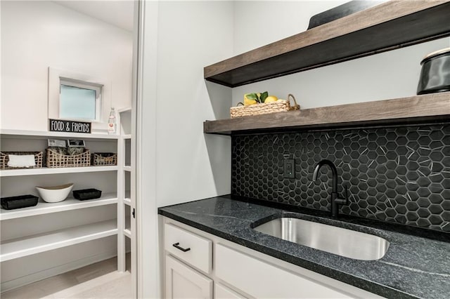 18221 W 168th Ter, Olathe, KS 66062 - bar with tasteful backsplash and light wood-type flooring