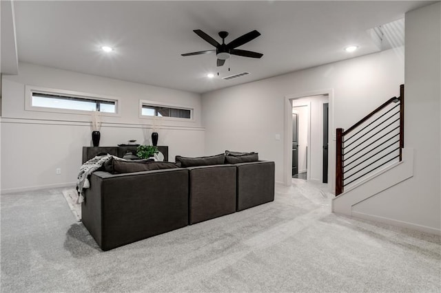 18221 W 168th Ter, Olathe, KS 66062 - carpeted living area with a ceiling fan, stairs, and recessed lighting