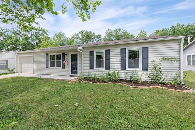 1520 E 18th St, Lawrence, KS 66044 - ranch-style home with a garage, a front yard, and concrete driveway