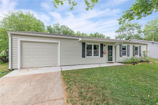 1520 E 18th St, Lawrence, KS 66044 - ranch-style house with concrete driveway, a garage, and a front yard