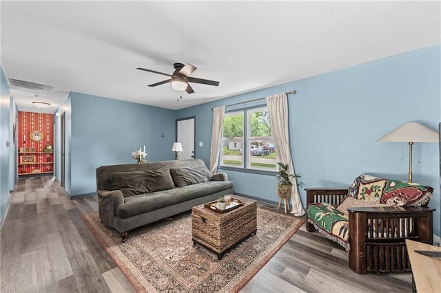 1520 E 18th St, Lawrence, KS 66044 - living area with wood finished floors and a ceiling fan