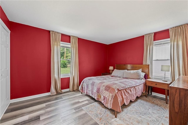 1520 E 18th St, Lawrence, KS 66044 - bedroom featuring wood finished floors and baseboards