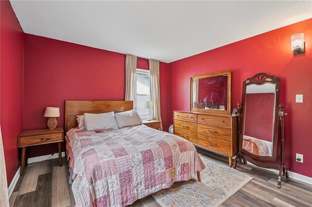 1520 E 18th St, Lawrence, KS 66044 - bedroom featuring wood finished floors