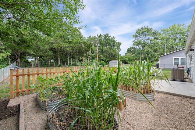 1520 E 18th St, Lawrence, KS 66044 - view of yard featuring a garden, a patio, and view of scattered trees