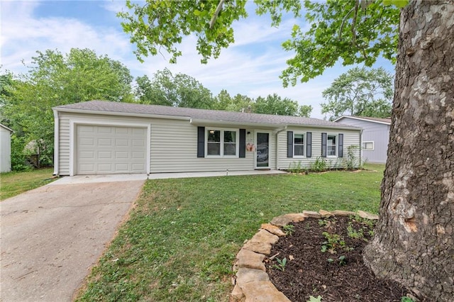 1520 E 18th St, Lawrence, KS 66044 - single story home with a garage, driveway, and a front lawn