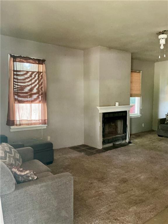 308 S 16th St, Independence, KS 67301 - carpeted living room with a fireplace with flush hearth