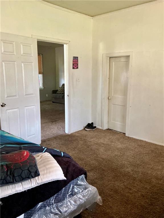 308 S 16th St, Independence, KS 67301 - carpeted bedroom with a closet and baseboards