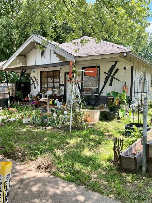308 S 16th St, Independence, KS 67301 - view of front facade with a shingled roof and covered porch