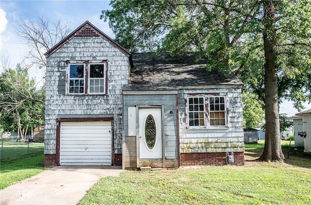 615 Mill St, Neodesha, KS 66757 - view of front of property featuring a garage, driveway, and roof with shingles