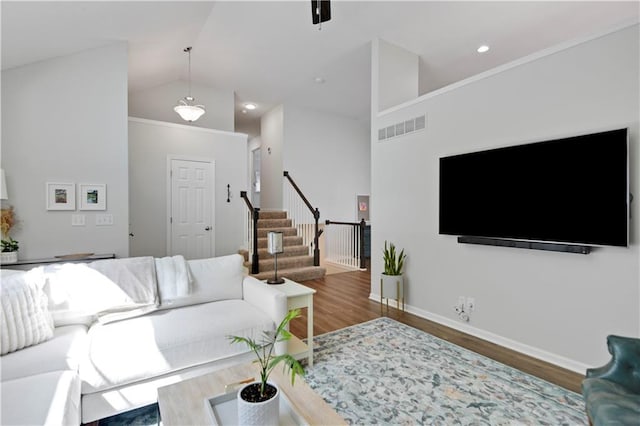 16113 S Cole St, Olathe, KS 66062 - living room featuring wood finished floors, stairway, and vaulted ceiling