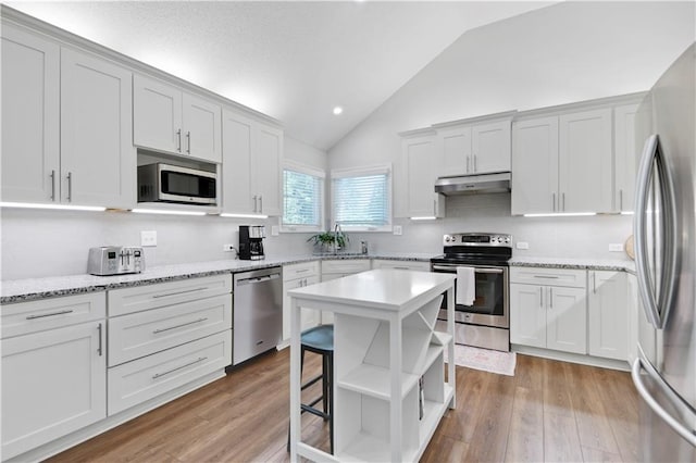 16113 S Cole St, Olathe, KS 66062 - kitchen featuring open shelves, appliances with stainless steel finishes, white cabinetry, under cabinet range hood, and recessed lighting