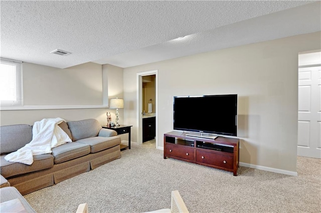 16113 S Cole St, Olathe, KS 66062 - carpeted living area featuring a textured ceiling and baseboards