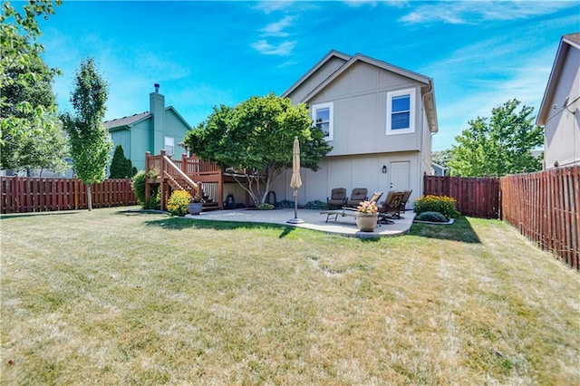 16113 S Cole St, Olathe, KS 66062 - back of property with a fenced backyard, stairway, a patio, and a deck