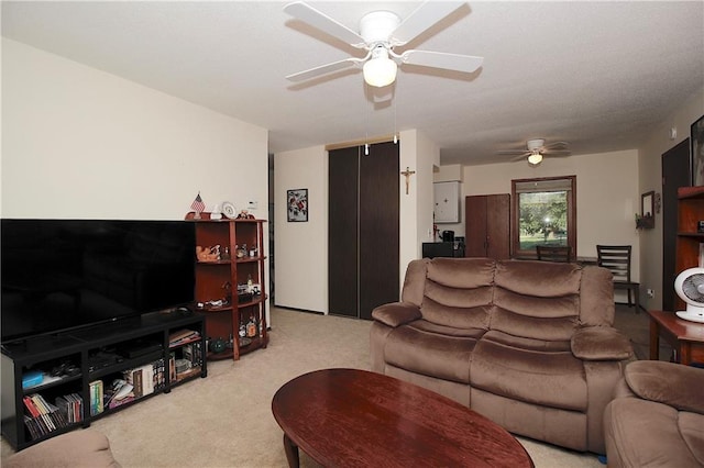 414 N Ash St, Garnett, KS 66032 - living room featuring a ceiling fan and carpet flooring