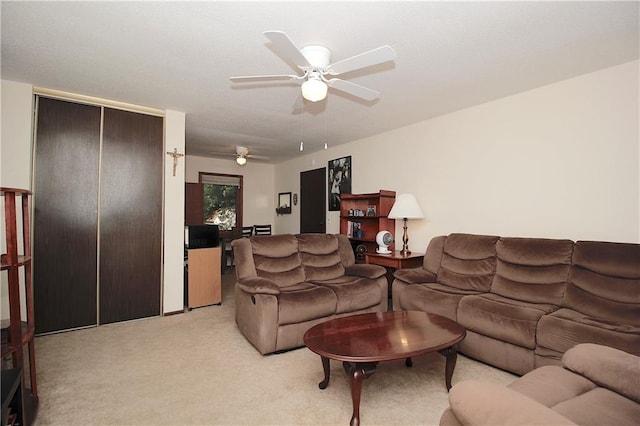 414 N Ash St, Garnett, KS 66032 - living room featuring light carpet and a ceiling fan