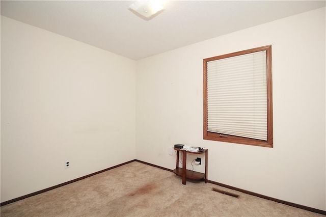 414 N Ash St, Garnett, KS 66032 - empty room with light colored carpet and baseboards