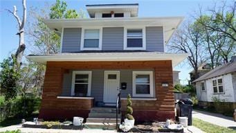 5007 Euclid Ave, Kansas City, MO 64130 - american foursquare style home featuring covered porch