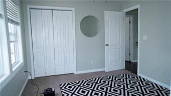 5007 Euclid Ave, Kansas City, MO 64130 - unfurnished bedroom with baseboards and a closet