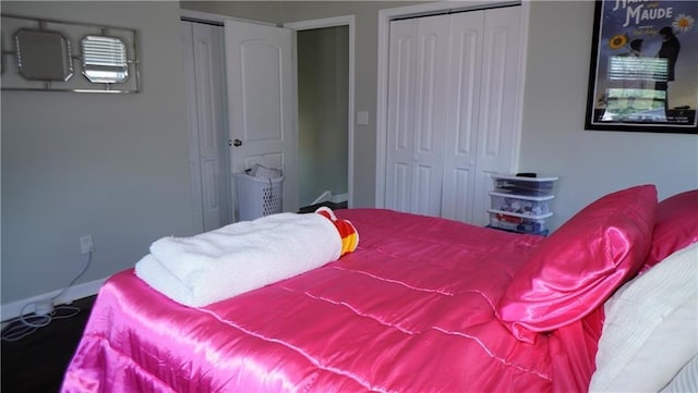 5007 Euclid Ave, Kansas City, MO 64130 - bedroom with baseboards and two closets